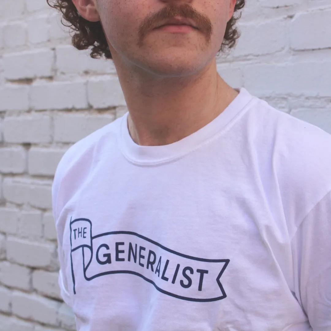 The Generalist Merch: Original Generalist Flag Tee in White