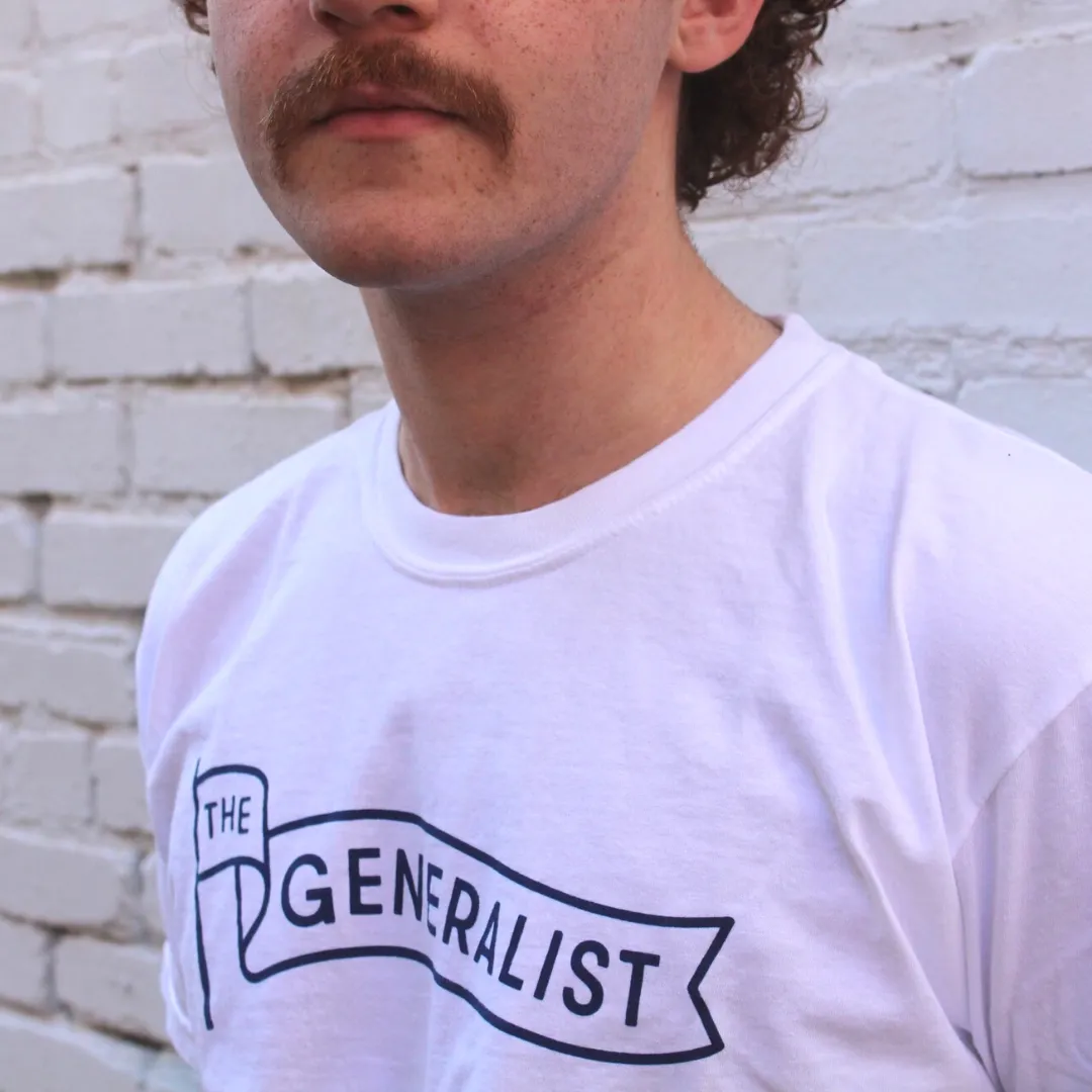 The Generalist Merch: Original Generalist Flag Tee in White